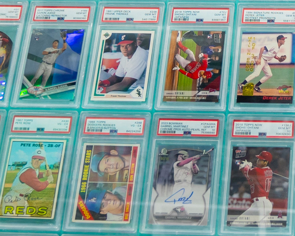 PSA graded card wall display at AA Mint Cards